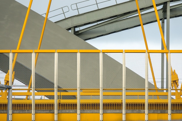 closeup-shot-yellow-grey-fragments-modern-bridge_181624-17554