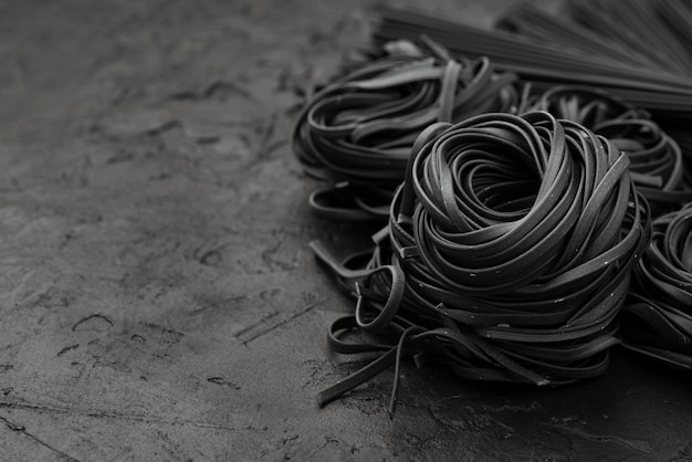 high-angle-black-tagliatelle-slate_23-2148461623