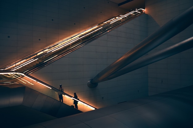 two-person-standing-escalator_400718-24
