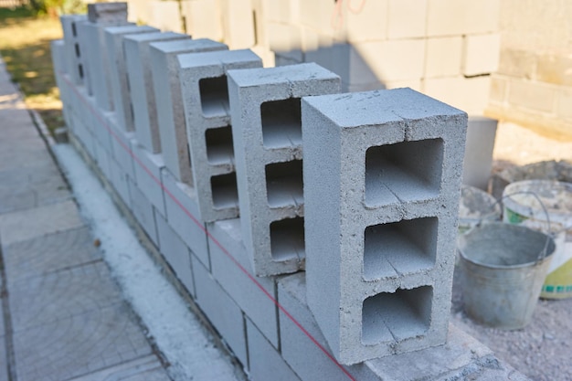 worker-builds-cinder-block-wall-new-home_661209-381