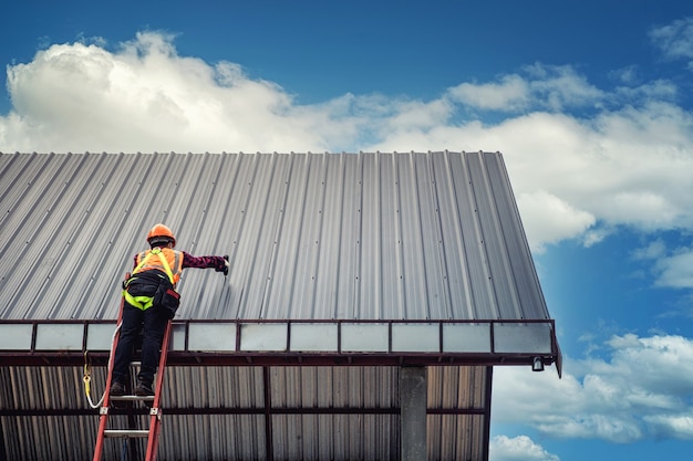 worker-man-building-tradesman-roof-house-with-safety-helmet_130181-1150
